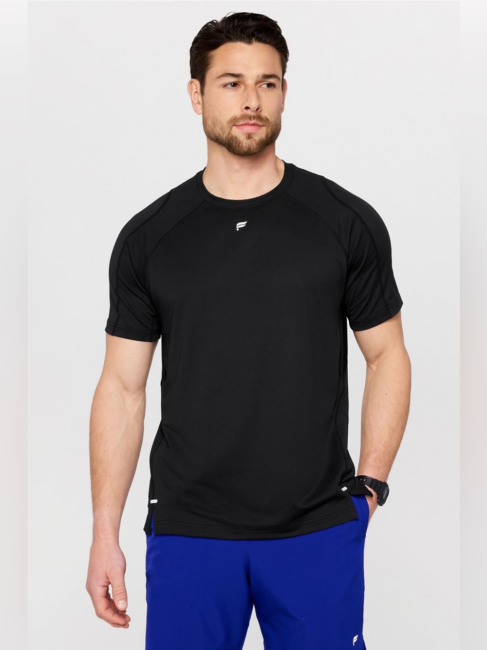 Fabletics The O2 Tee in black features an ultra-lightweight, breathable Large
